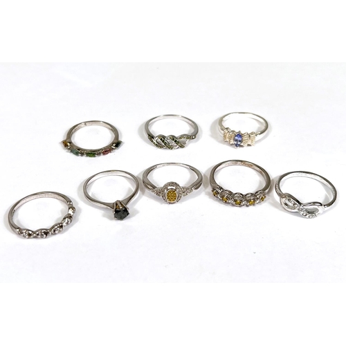 638 - Eight silver rings in a variety of designs, set assorted coloured stones, 14.9gm