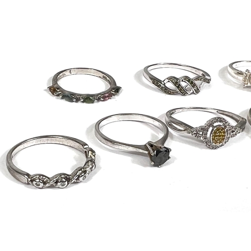 638 - Eight silver rings in a variety of designs, set assorted coloured stones, 14.9gm