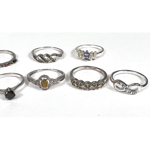 638 - Eight silver rings in a variety of designs, set assorted coloured stones, 14.9gm