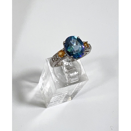 639 - A silver ring set large oval colour changing stone; a gold toned silver ring with small diamonds in ... 