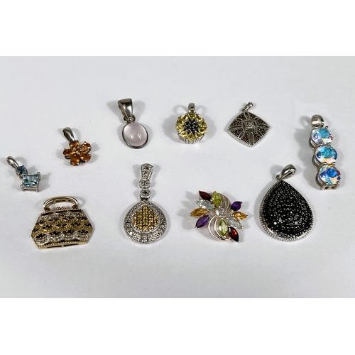 640 - Ten silver pendants set with a variety of coloured stones