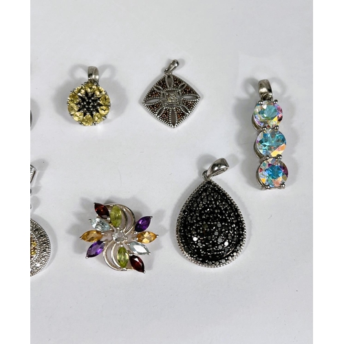 640 - Ten silver pendants set with a variety of coloured stones