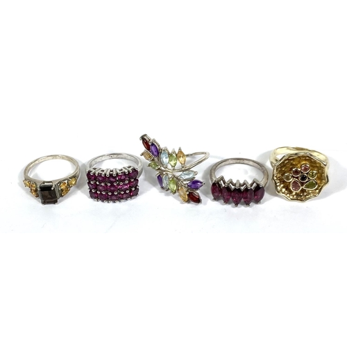 640A - Eight silver rings, stamped '925', variety of designs and set with a variety of coloured stones