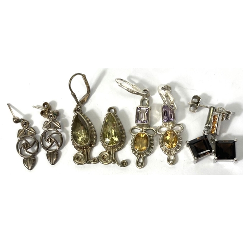 647B - Twelve pairs of silver earrings in a variety of styles, set coloured stonesNo bids sold with next lo... 