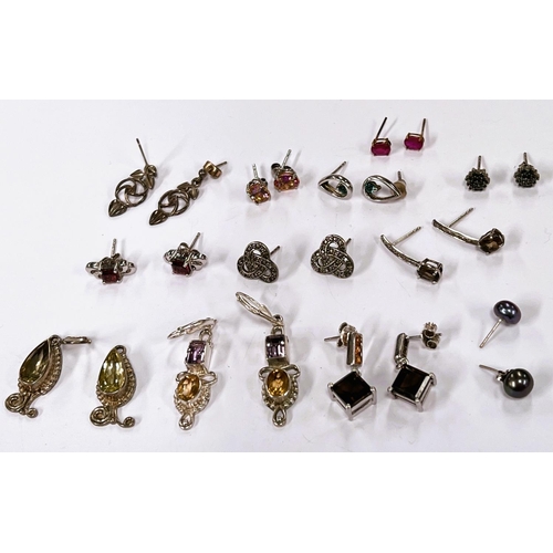 647B - Twelve pairs of silver earrings in a variety of styles, set coloured stonesNo bids sold with next lo... 