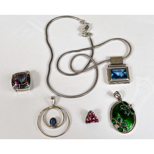 648 - A silver rectangular pendant set bright blue stone, on reticulated silver chain; a silver pendant se... 