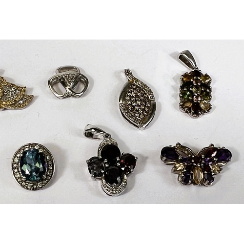 649B - Ten silver pendants set with a variety of coloured stones