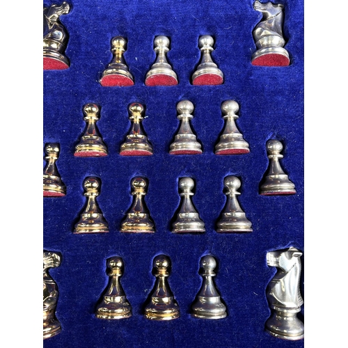 695 - A hallmarked silver and silver gilt Chess Set in a fitted wooded case, Birmingham 1974, Swatkins Gro... 