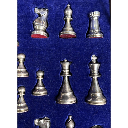 695 - A hallmarked silver and silver gilt Chess Set in a fitted wooded case, Birmingham 1974, Swatkins Gro... 