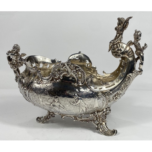 698 - A 19th century French rococo vase, boat shaped with cherub mounts to the prow and stern and extensiv... 