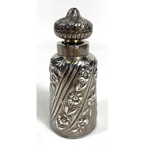 706 - A 19th century large glass scent bottle, covered with silver spiral and embossed floral stripes, Lon... 