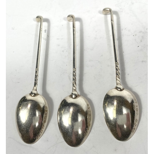 708 - A pierced sifter spoon; 4 small hallmarked silver teaspoons and a flask, various dates, 4oz; a white... 