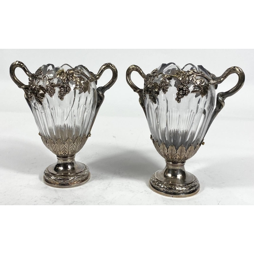 709 - A Continental pair of cut glass vases, ovoid ribbed form with extensive cast white metal mounts on t... 