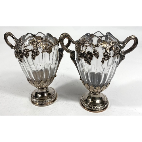 709 - A Continental pair of cut glass vases, ovoid ribbed form with extensive cast white metal mounts on t... 