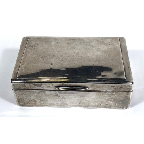 711 - A hallmarked silver rectangular cigarette box with hinged lid and weighted base, London 1903 (some d... 