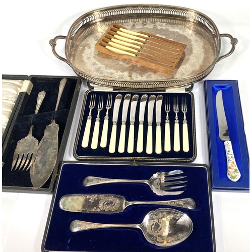 713 - A cased set of dessert knives and forks; cased serving sets; a silver on copper gallery tray; a frui... 