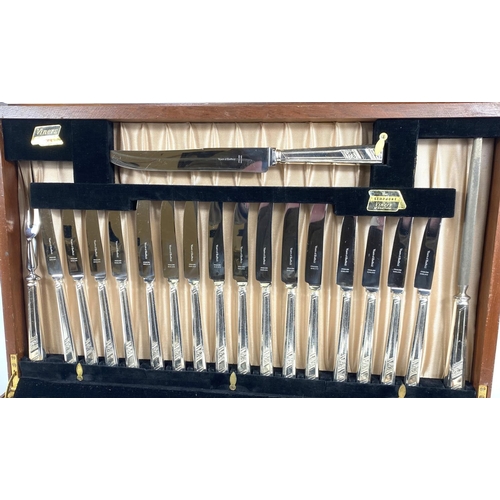 714 - A Viner's canteen of silver plated cutlery, 8 setting, in fitted mahogany table cabinet