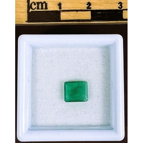 718 - A square cushion cut emerald, 0.9 carats