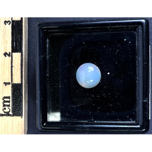 718C - A round cabochon opal, 0.9 carat