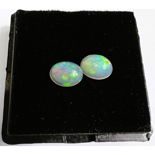 719 - Two oval cabochon opals, 2.15 carat