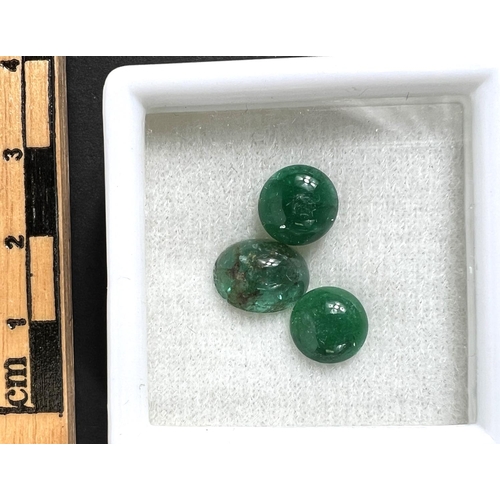 719C - Two round and 1 oval cabochon cut emeralds, 5.32 carat