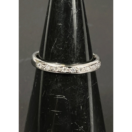 746 - A hallmarked platinum 1/2 eternity ring set with 9 diamonds, 5gm, size N-O