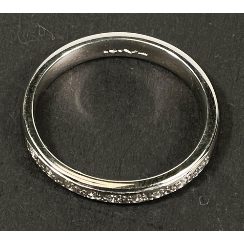 746 - A hallmarked platinum 1/2 eternity ring set with 9 diamonds, 5gm, size N-O