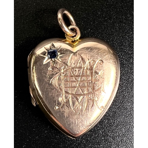 752 - A monogrammed heart pendant locket set with a sapphire, 3.4gm (tests as circa 9ct)