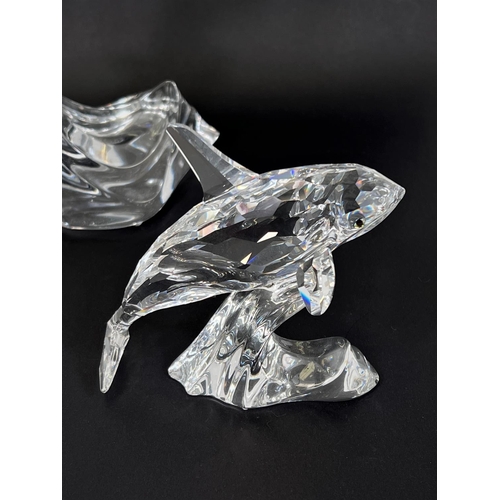 509 - A Swarovski crystal leaping dolphin, ht.20cm; A Swarovski crystal leaping OrcA