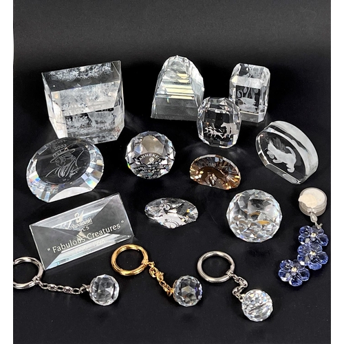 565A - A selection of Swarovski crystal paperweights and key rings etc (15 pieces)