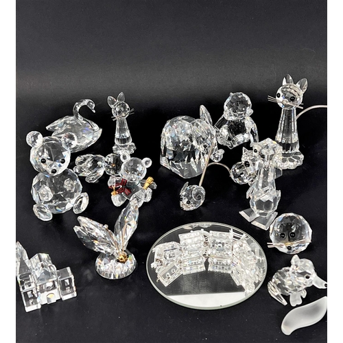 571 - Approx 20 pieces of Swarovski crystal to include a miniature 4 piece train set on mirror, a church, ... 