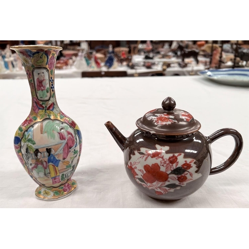 363 - An 18th century Chinese Batavia teapot with burnt orange floral decoration and brown glaze (with chi... 