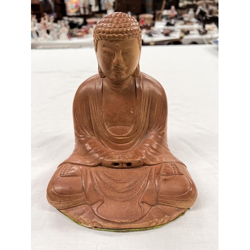 365 - A Japanese stoneware depiction of Buddha seated in lotus position height 18cm