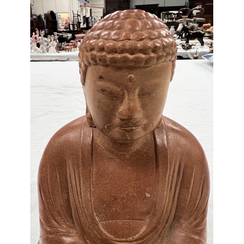 365 - A Japanese stoneware depiction of Buddha seated in lotus position height 18cm