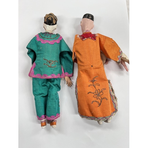 370 - 2 Chinese opera dolls in traditional clothes, painted faces with associated box height 25.5cm