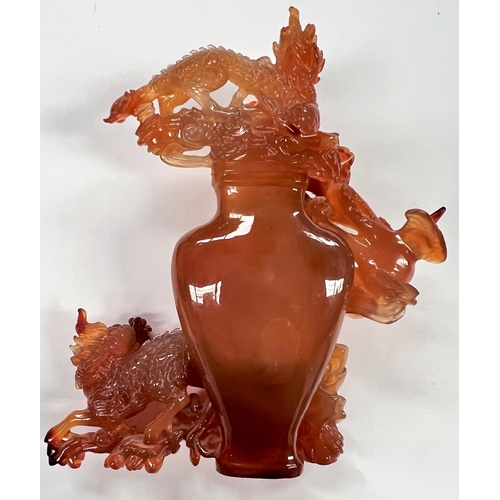 371 - A Chinese amber coloured hardstone carving of vase surrounded by mythical creatures (birds tail glue... 