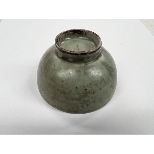 375 - A Chinese celadon glazed bowl with foot on associated hardwood stand diameter 9.5cm