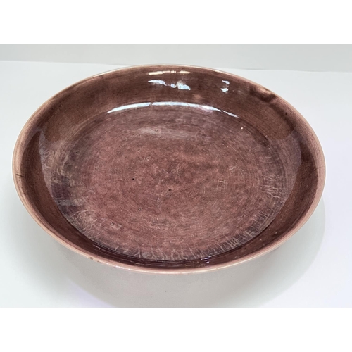 405 - A Chinese plum coloured dish with incised yellow decoration to the outside of dish with birds etc, m... 