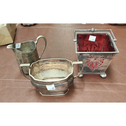 172B - A good quality silver plate arts and crafts basket with cranberry glass liner and two other similar ... 