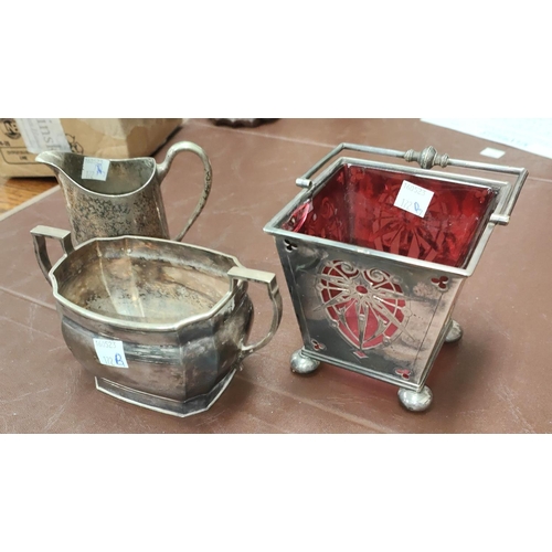 172B - A good quality silver plate arts and crafts basket with cranberry glass liner and two other similar ... 