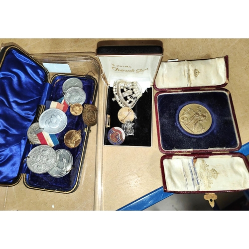 203 - A collection of various medals including a bronze 1908 cooking medal in a case; badges and Victorian... 