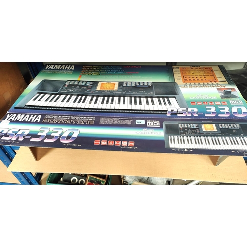 284 - A Yamaha Portatone electronic keyboard PSR-330 boxed