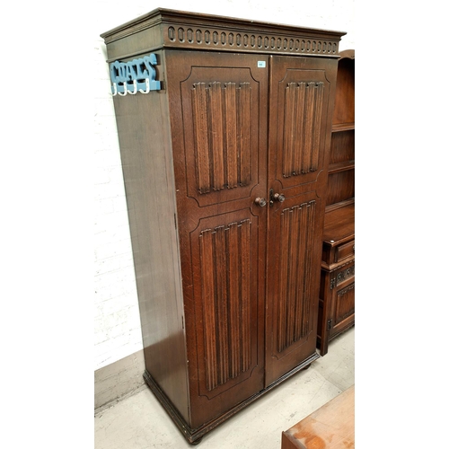 846 - A Jacobean style carved oak bedroom suite of 4 pieces comprising double door wardrobe, 4 height ches... 