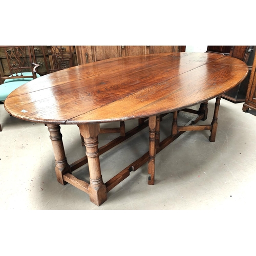 856 - An very large and impressive 18th century style oak wakes table on turned gun barrel legs length 245... 