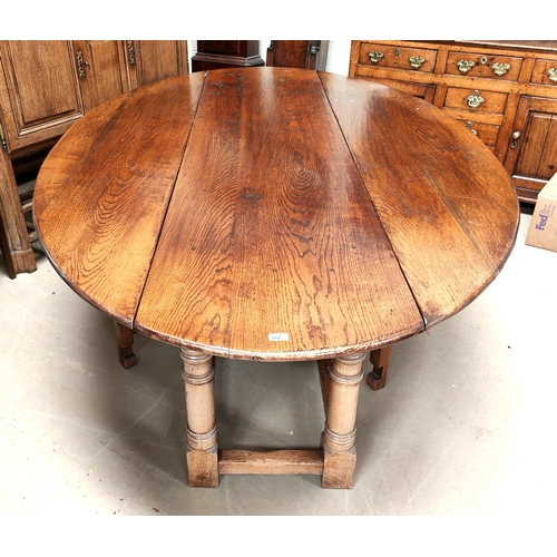 856 - An very large and impressive 18th century style oak wakes table on turned gun barrel legs length 245... 