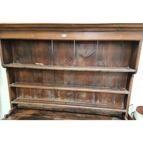 860 - An 18th century Country made Welsh dresser with 3 height delft rack over 3 frieze drawers, 2 side cu... 