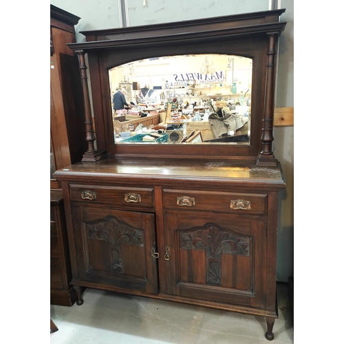 909 - A Art Nouveau mirror back sideboard with copper handles carved doors, turned supports behind