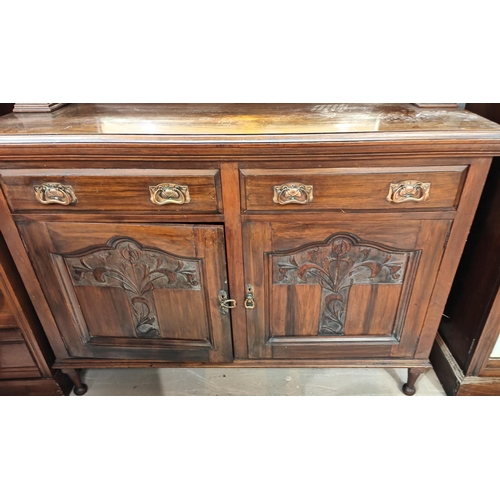 909 - A Art Nouveau mirror back sideboard with copper handles carved doors, turned supports behind