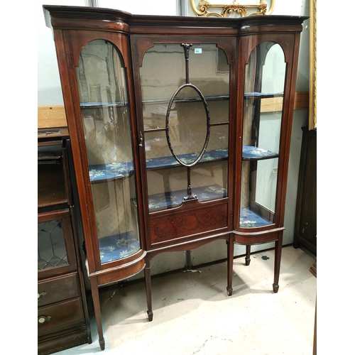 924 - An inlaid mahogany display cabinet with single astragal glazed door, curved glazed display on each s... 