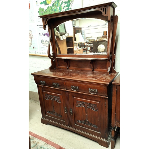 925 - An Art Noveau mahogany mirror back sideboard with carved floral decoration, double cupboards and dou... 